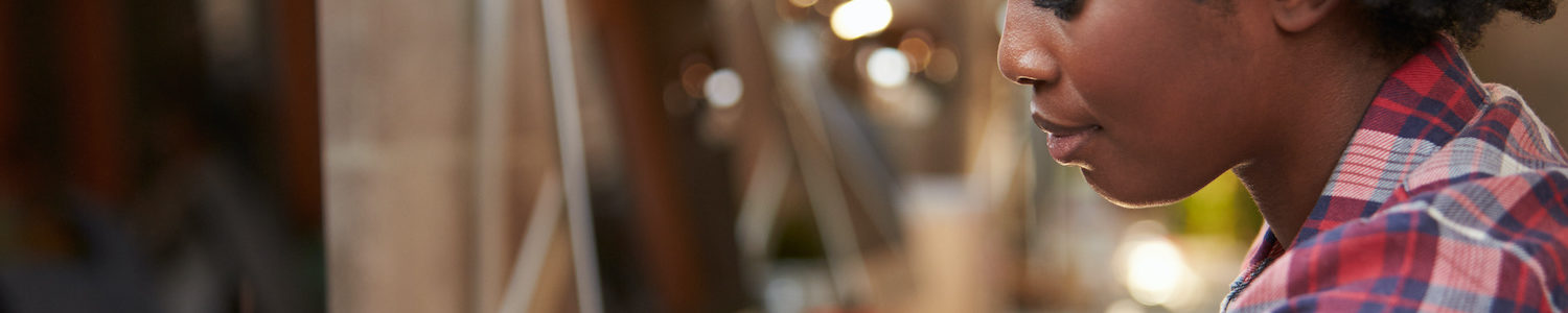 A woman in supply chain using a wearable device by allegiance staffing.