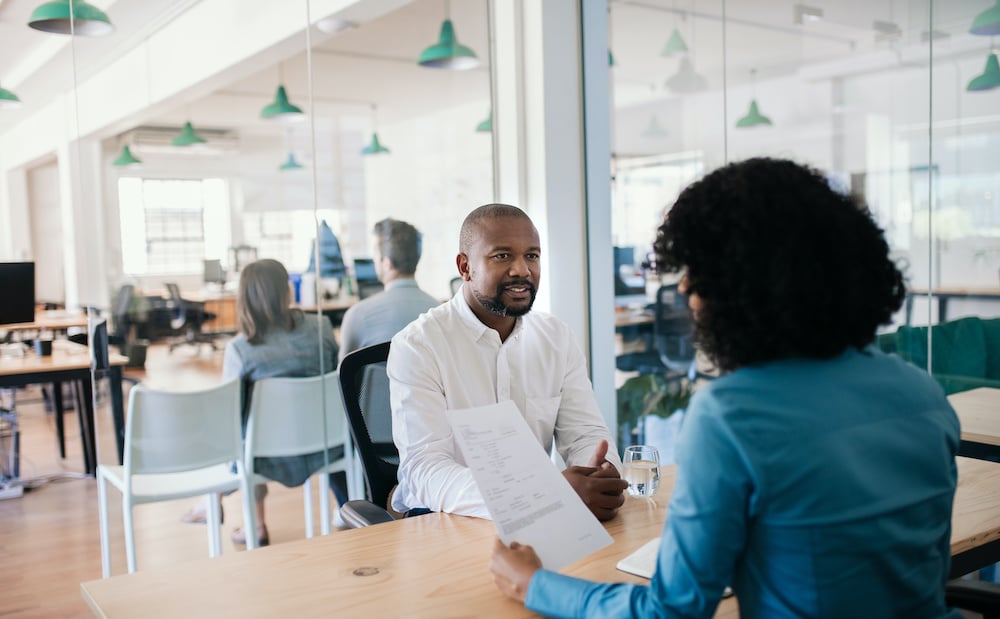 Job applicant asking questions in interview by allegiance staffing.