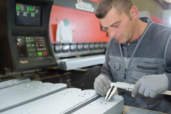 A man working a temporary factory job f by allegiance staffing in houston, texas.