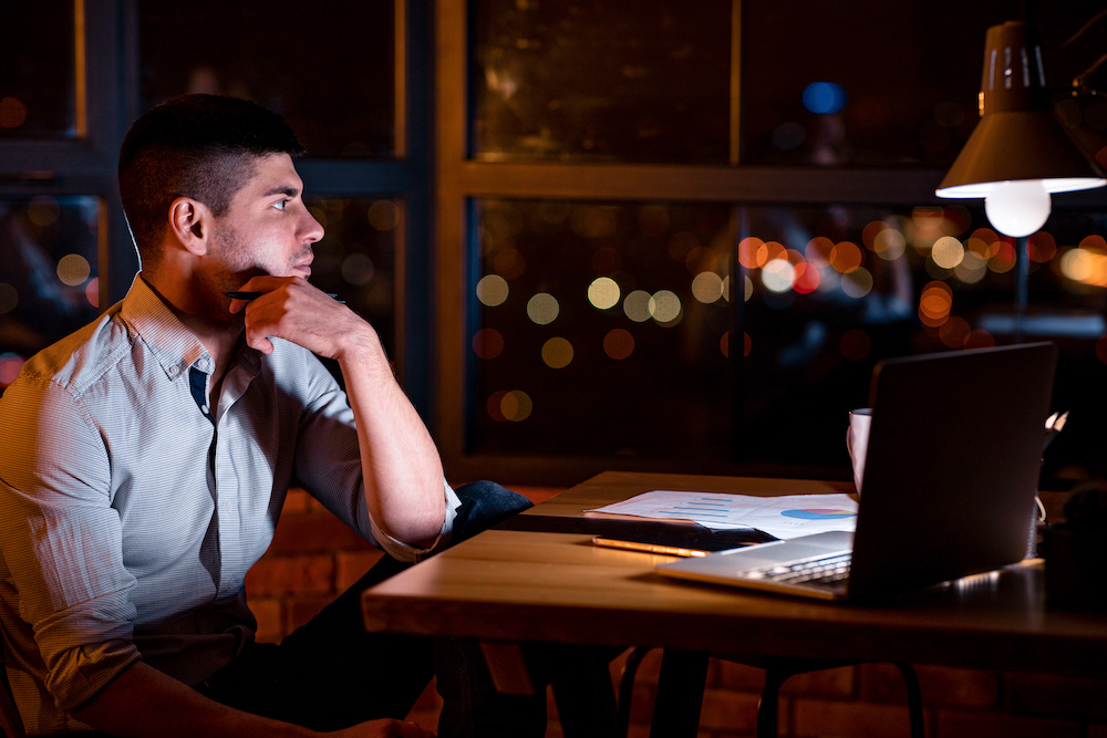 Man contemplating challenges of working overnight looking for tips to adapt