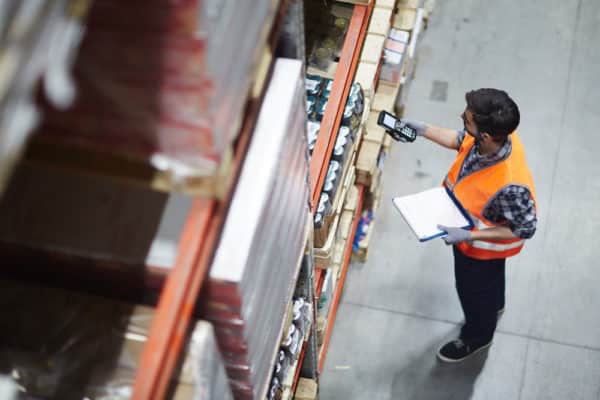 Man working in warehouse after looking through part time overnight jobs on his career path