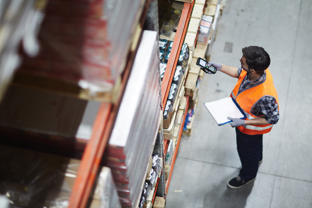 Man working in warehouse after looking through part time overnight jobs on his career path