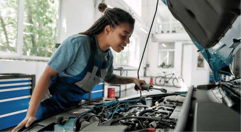 About 4 mechanic inspecting car