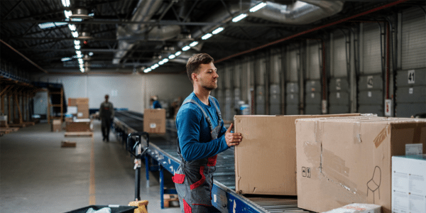 Temporary worker in the warehouse after learning more about whether temps get overtime pay