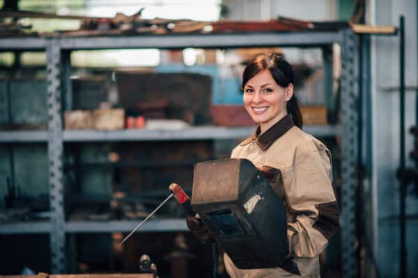 Hard-working woman in a manufacturing environment after learning more about non-fast food jobs near me