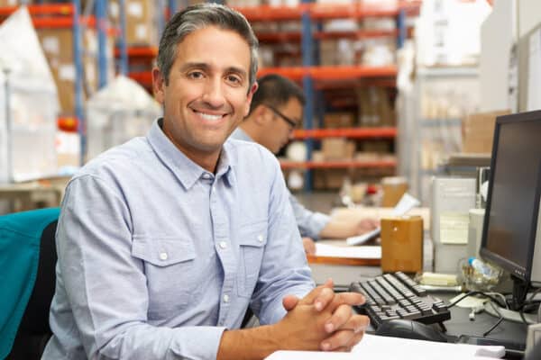 Multi-Location Warehouse Management Tips for Success 6 Warehouse manager satisfied after reading our tips for multi-location warehouse management