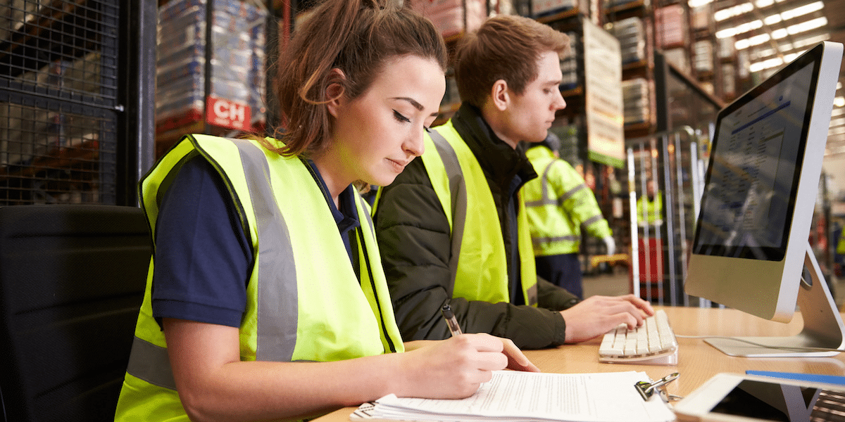 Warehouse workers addressing their tasks for the day