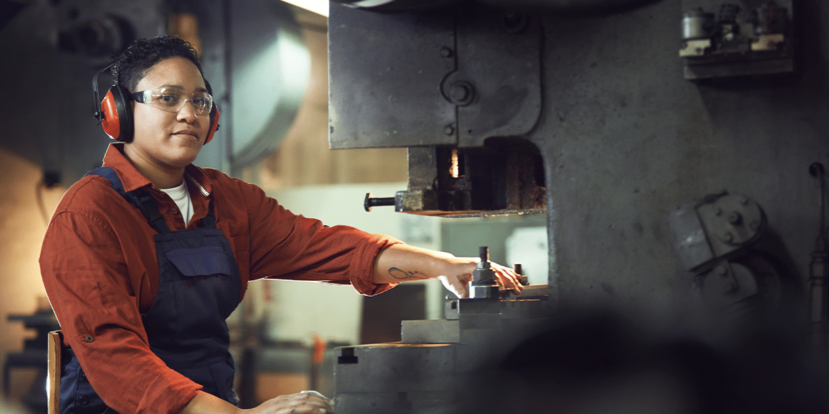 Factory worker performing duties in a factory to support their supply chain