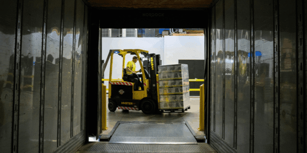 Forklift driver moving boxes to represent forklift driver jobs