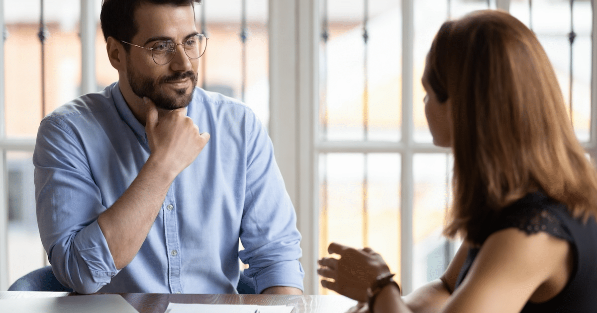 Employer sitting down with a prospective employee for a new role in the company