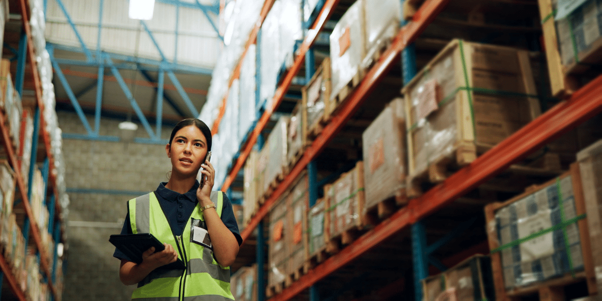Warehouse worker using technology to verify the status of an order